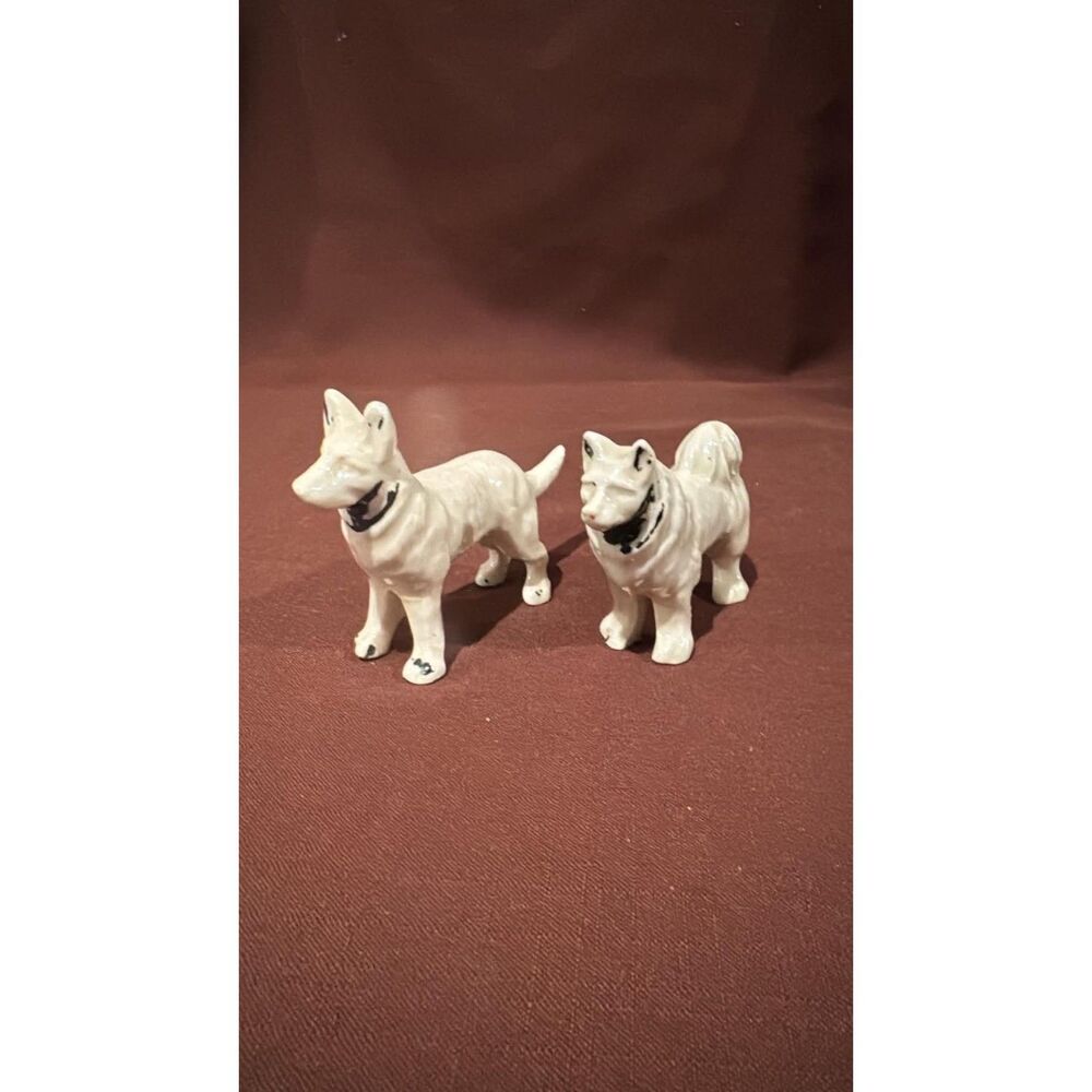 Ceramic  Painted Dogs Around 3 inches tall  Black and White
